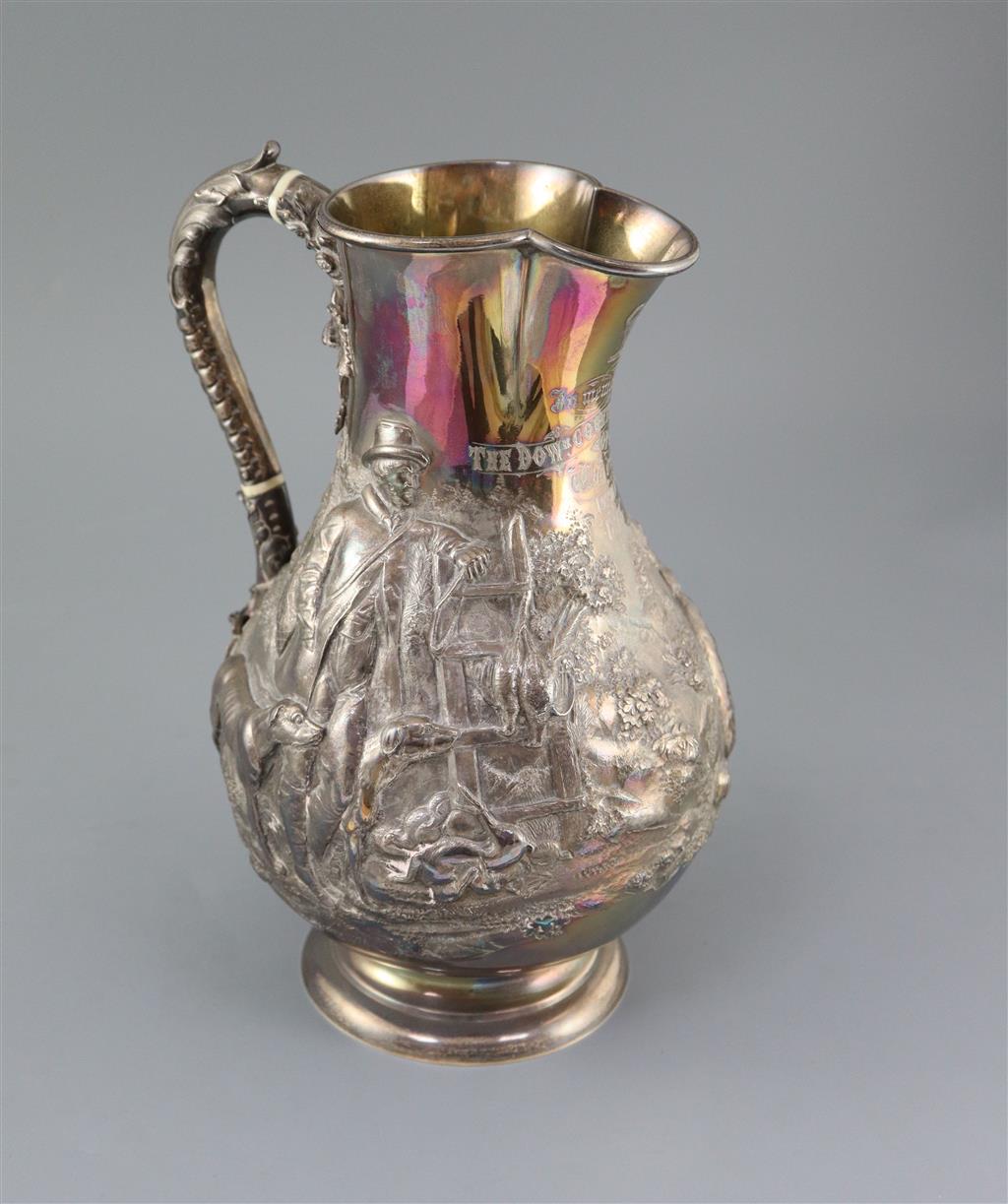 A large Victorian silver baluster hot water jug, by Robert Hennell IV,